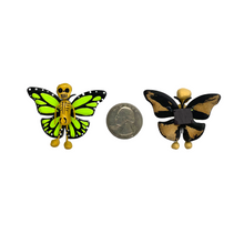 Load image into Gallery viewer, Mexican handmade folkart butterfly mariposa featuring calavera for day of the dead or Dia de muertos. crafted of barro and wood, meticulously handpainted and unique. Comes in 2-pack set. 