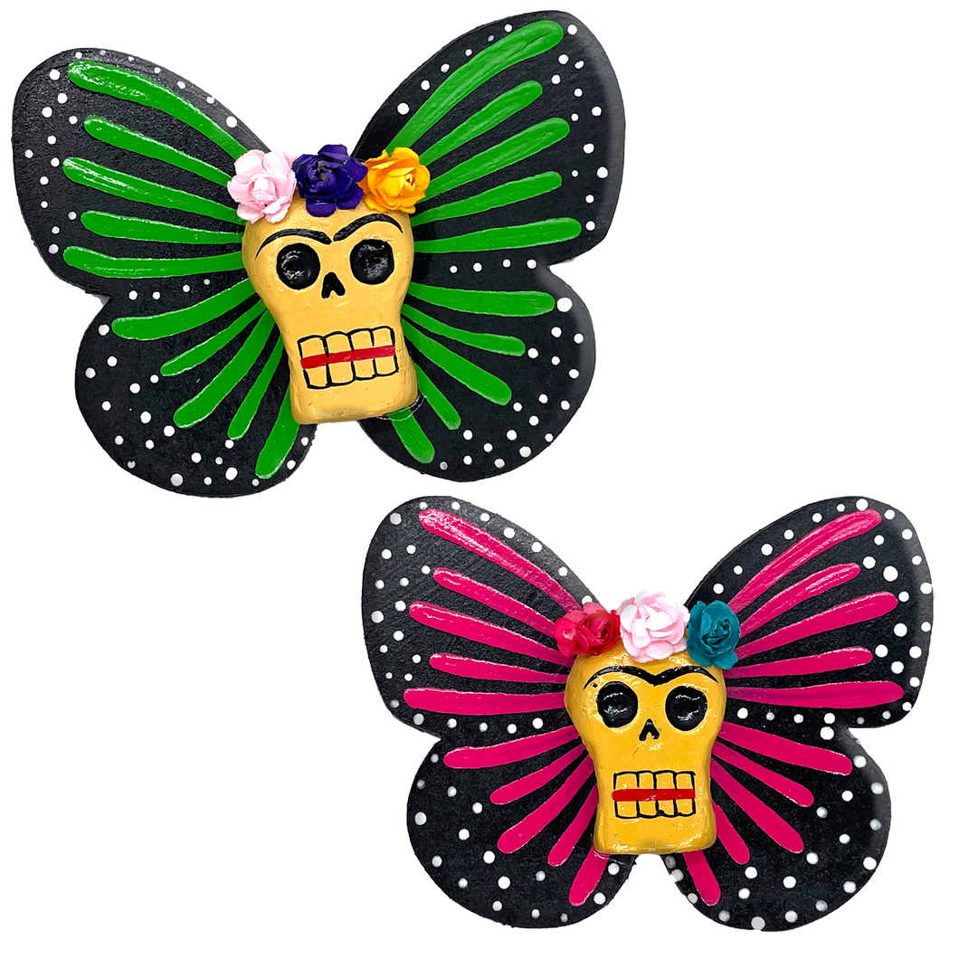 Mexican handmade folkart butterfly mariposa featuring calavera Frida with flower crown. crafted of barro and wood, meticulously handpainted and unique. Comes in 2-pack set.