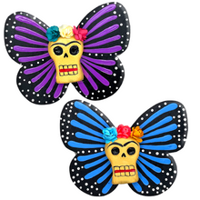 Load image into Gallery viewer, Mexican handmade folkart butterfly mariposa featuring calavera Frida with flower crown. crafted of barro and wood, meticulously handpainted and unique. Comes in 2-pack set.