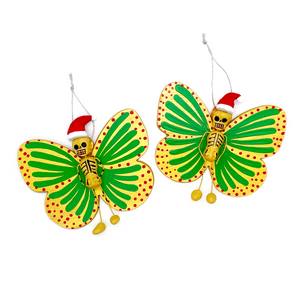 Mexican handmade folkart butterfly mariposa christmas and navidad ornament featuring calavera calaca clause. crafted of barro and wood, meticulously handpainted and unique. Comes in 2-pack set.
