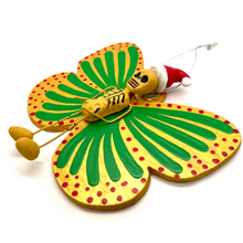 Load image into Gallery viewer, Mexican handmade folkart butterfly mariposa christmas and navidad ornament featuring calavera calaca clause. crafted of barro and wood, meticulously handpainted and unique. Comes in 2-pack set.