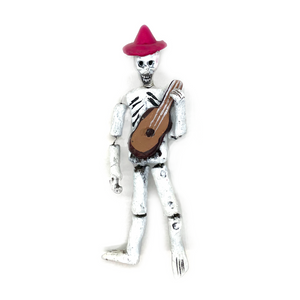 Mexican handmade traditional folk-art calaca skeleton musician with instrument. Can be hung or bends to display 